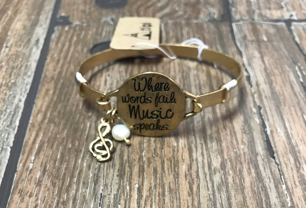 Bracelet “when words fail music speaks” gold