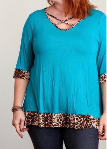 Plus teal 3/4 sleeve top with leopard trim and crisscross neck